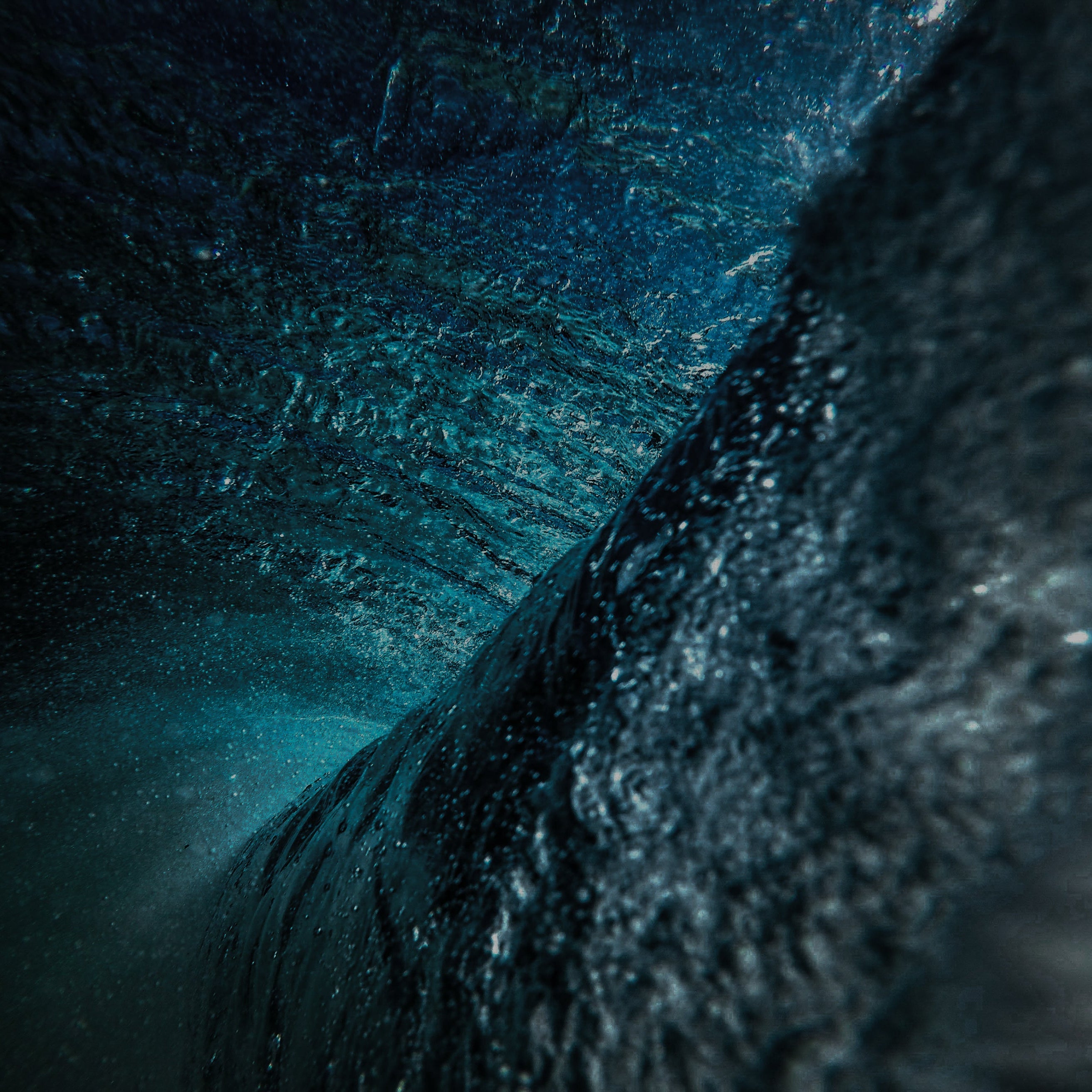 Close-up of textured dark blue surface with a blurred background